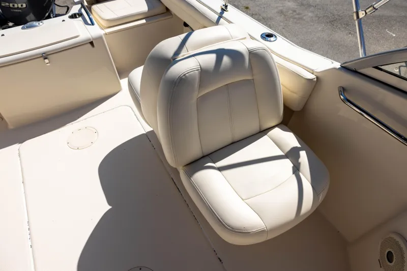 Slide: The Image of 2018 Grady-White Freedom 215 boat interior with white cushioned seating. - 8