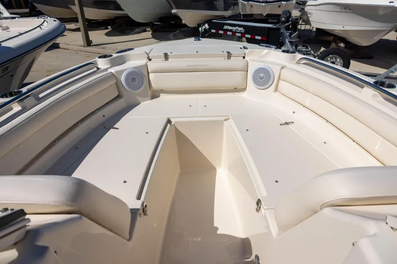 Slide: The Image of 2018 Grady-White Freedom 215 boat interior with spacious seating and speakers. - 9