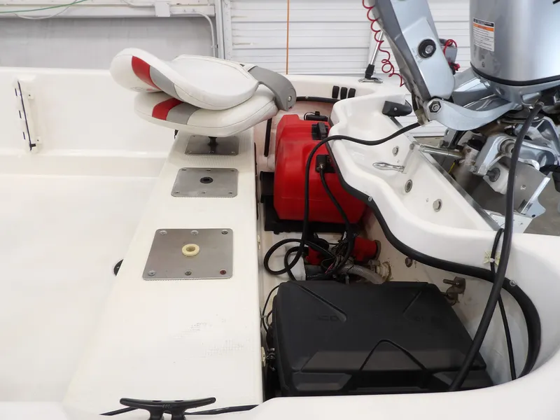 Slide: The Image of Interior view of a 2017 Bass Cat Phelix boat with motor and seat. - 17