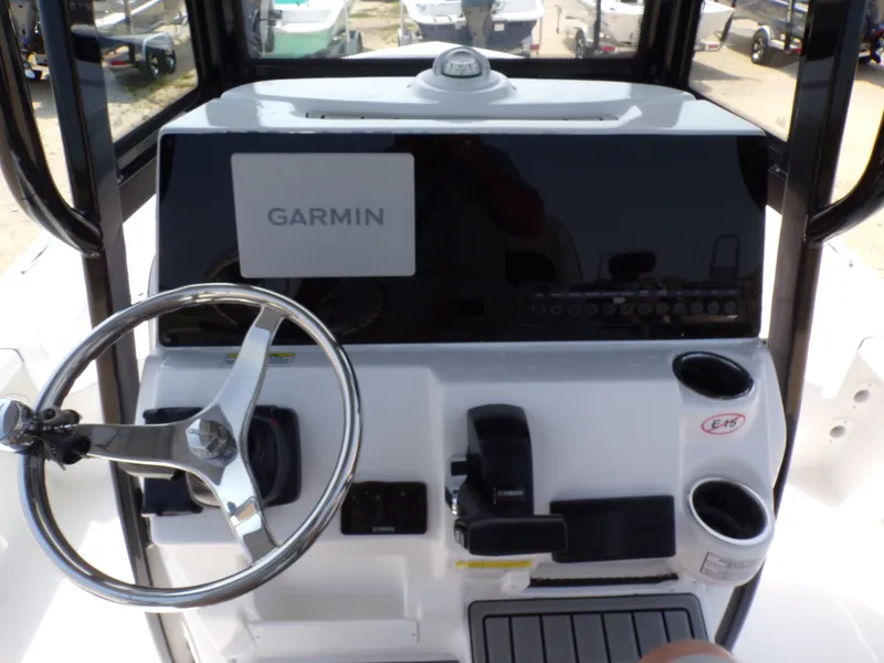 Slide: The Image of Tidewater 2210 Carolina Bay 2026 helm with Garmin navigation system. - 21
