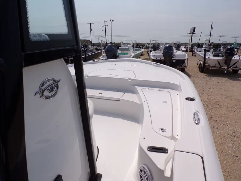 Slide: The Image of 2026 Tidewater 2210 Carolina Bay boat in a parking lot. - 25