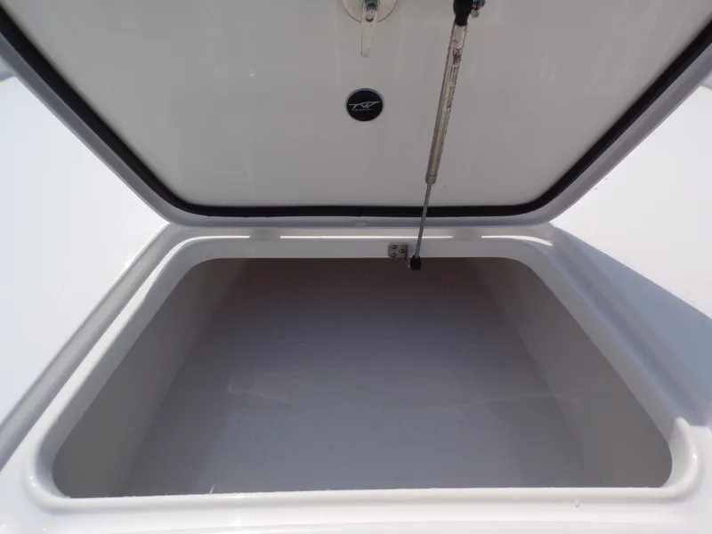Slide: The Image of Open storage compartment in 2026 Tidewater 2210 Carolina Bay boat. - 30