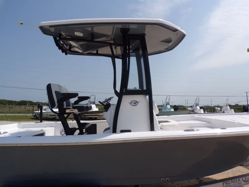 Slide: The Image of 2026 Tidewater 2210 Carolina Bay boat side view outdoors. - 47