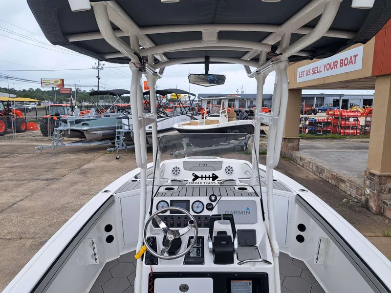 Slide: The Image of Interior view of a 2020 Yamaha 210 FSH Sport boat in sales area. - 9