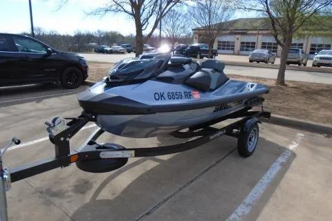 Slide: The Image of 2024 Sea-Doo RXP-X 325 jet ski on trailer in parking lot. - 3