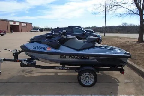 Slide: The Image of 2024 Sea-Doo RXP-X 325 jet ski on trailer in parking lot. - 4
