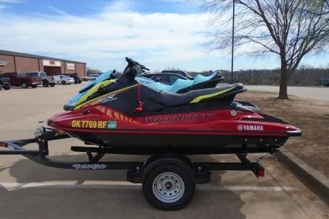 Slide: The Image of 2024 Yamaha WaveRunner EX Deluxe on trailer, parked outdoors. - 1