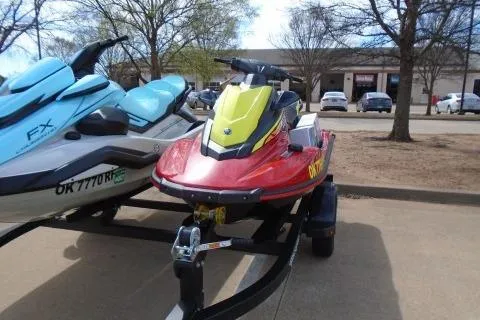 Slide: The Image of 2024 Yamaha WaveRunner EX Deluxe jet ski on trailer, parked outdoors. - 6