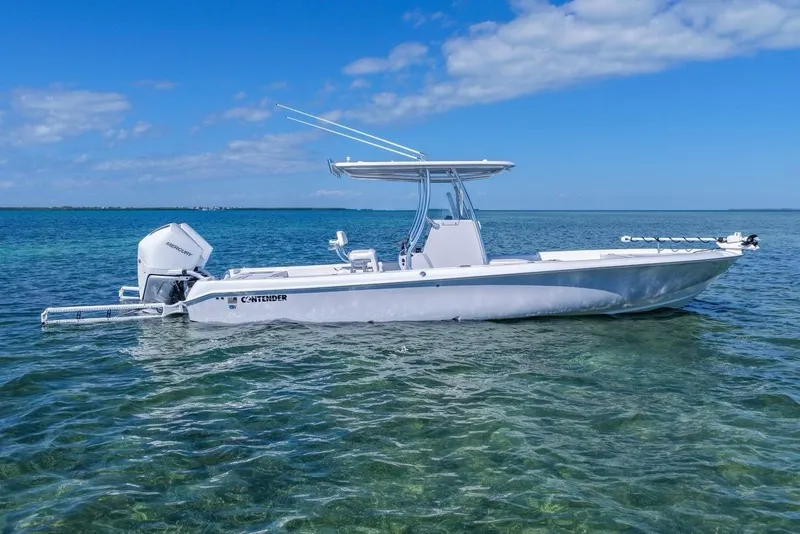 The Image of 2026 Contender 29 Bay boat on clear blue water under a sunny sky. - 0