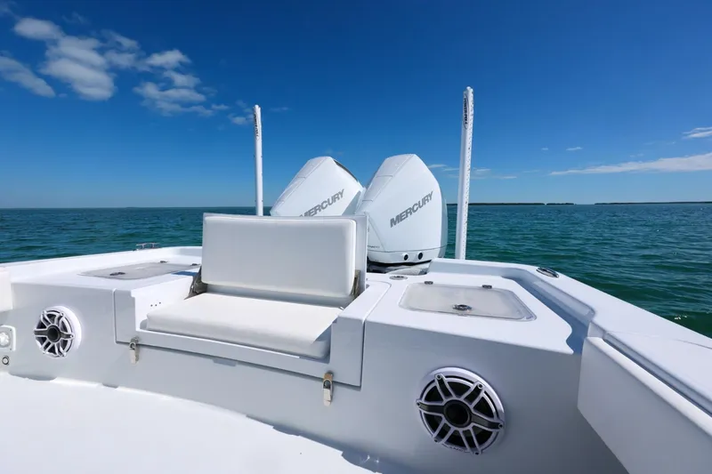 Slide: The Image of 2026 Contender 29 Bay boat with dual Mercury engines on open water. - 10