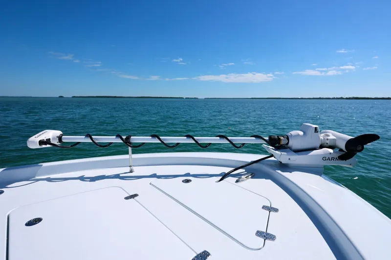 Slide: The Image of 2026 Contender 29 Bay boat with Garmin equipment on calm blue water. - 19