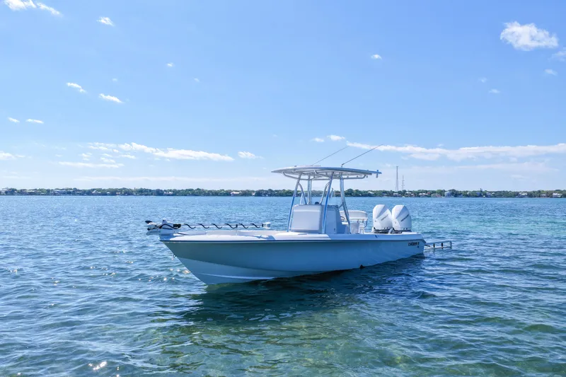 Slide: The Image of 2026 Contender 29 Bay boat on clear blue water under a sunny sky. - 5