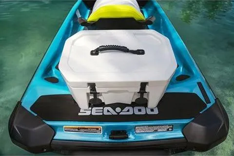 Slide: The Image of 2024 Sea-Doo GTI SE 170 with storage box on turquoise water. - 2