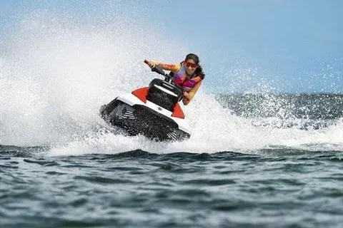 Slide: The Image of 2024 Sea-Doo Spark Trixx jet ski performing tricks on open water. - 4
