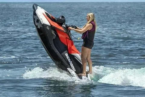 Slide: The Image of 2024 Sea-Doo Spark Trixx performing tricks on the ocean, showcasing agility and fun. - 5