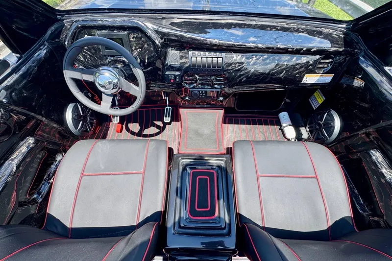 Slide: The Image of Interior of 2025 Watersports Car Series R, featuring sleek black and red design elements. - 10