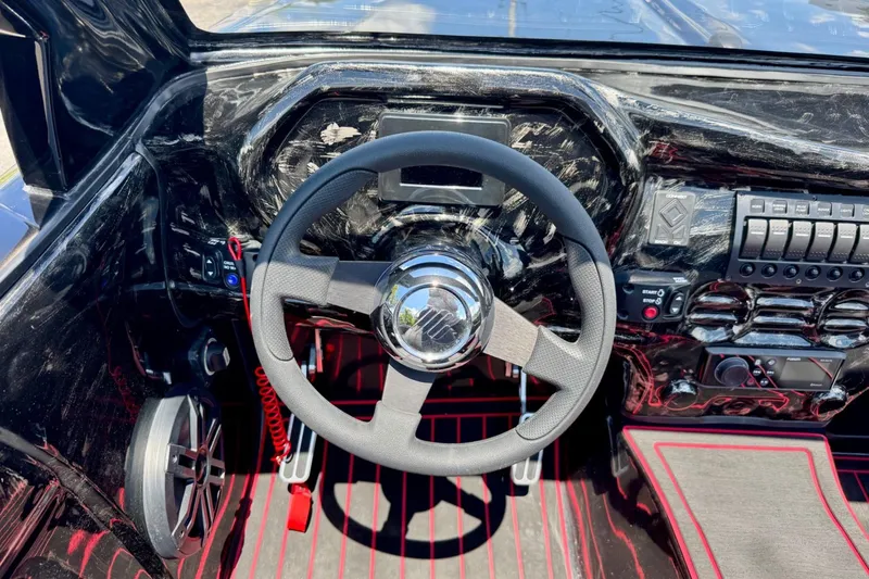 Slide: The Image of Interior dashboard of 2025 Watersports Car Series R with sleek steering wheel design. - 11