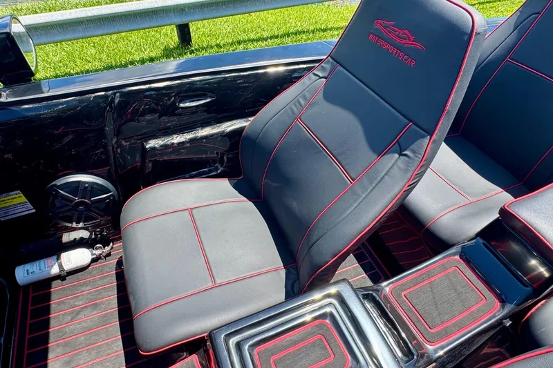 Slide: The Image of Interior of 2025 Watersports Car Series R with sleek black and red seats. - 14