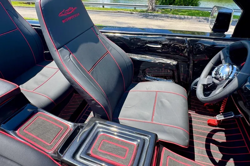 Slide: The Image of Interior of 2025 Watersports Car Series R with sleek black and red design. - 15
