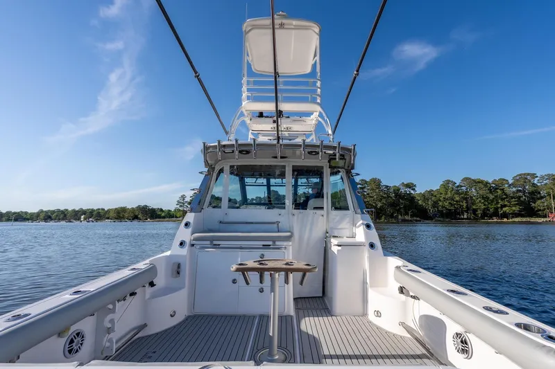 Slide: The Image of Everglades 350EX 2011 boat on calm water with clear sky. - 12