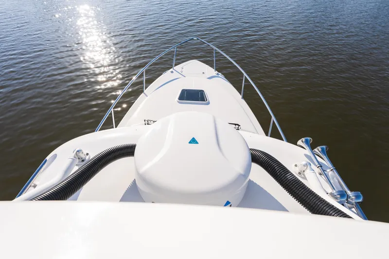 Slide: The Image of Bow view of 2011 Everglades 350EX boat on calm water, under bright sunlight. - 16