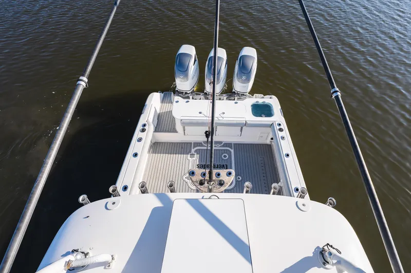 Slide: The Image of Overhead view of 2011 Everglades 350EX boat with dual engines on water. - 17