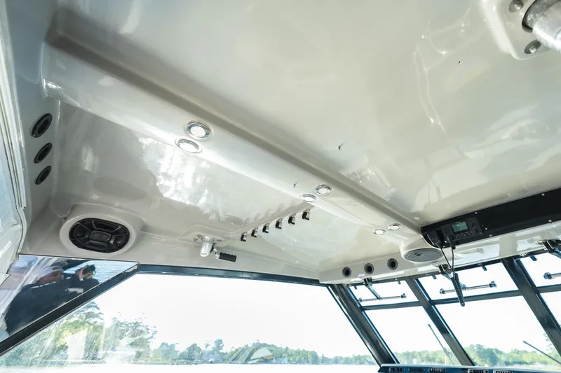 Slide: The Image of Interior view of 2011 Everglades 350EX boat, featuring ceiling speakers and lighting. - 21