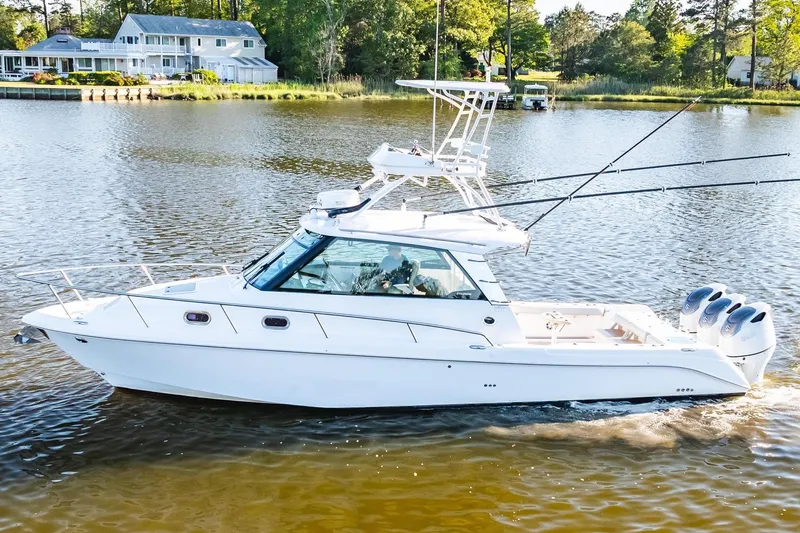 Slide: The Image of 2011 Everglades 350EX boat on calm water. - 4