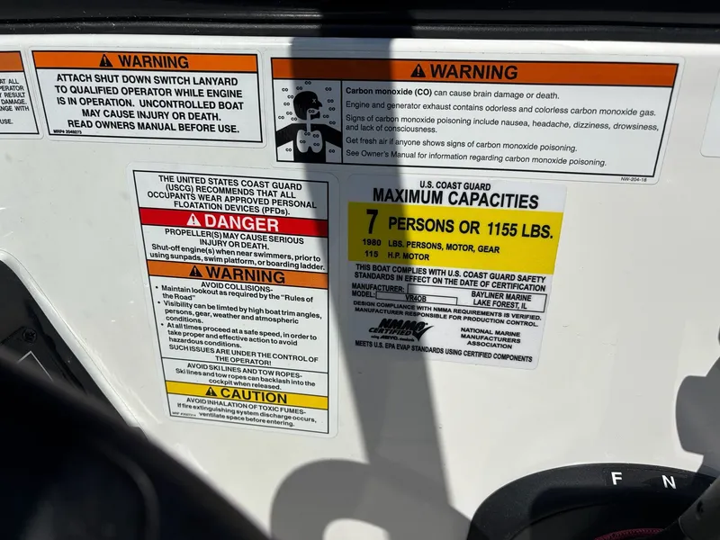 Slide: The Image of Safety warnings and capacity details on a 2019 Bayliner VR4 Bowrider OB. - 11