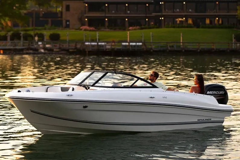 Slide: The Image of 2019 Bayliner VR4 Bowrider OB on calm water at sunset. - 18