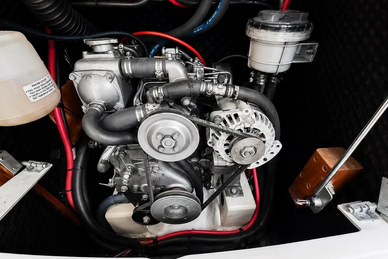 Slide: The Image of Engine compartment of a 2001 Beneteau 361 sailboat, showcasing mechanical components and wiring. - 16