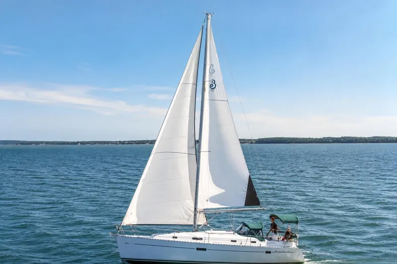 Slide: The Image of Sailing yacht Beneteau 361, 2001 model, cruising on open water under clear skies. - 2