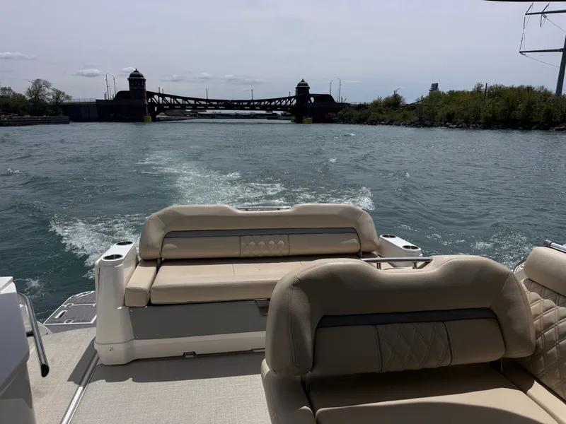 Slide: The Image of Rear view of 2022 Regal 36 Grand Coupe on the water. - 2