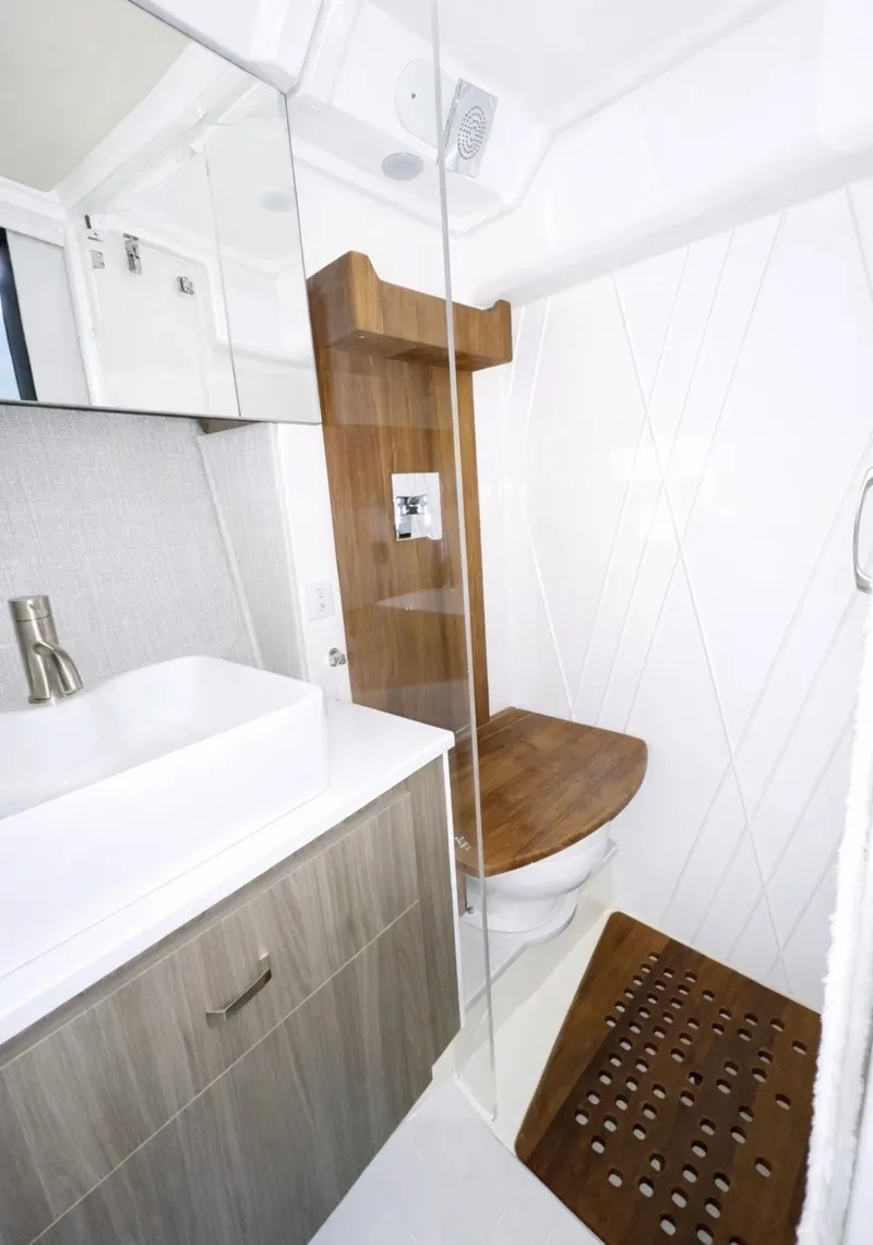 Slide: The Image of Luxurious bathroom in the 2022 Regal 36 Grand Coupe boat. - 33