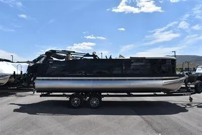 Slide: The Image of 2026 Lowe SF 232 Sport Fish pontoon boat on trailer under clear sky. - 10