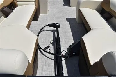 Slide: The Image of 2026 Lowe SF 232 Sport Fish boat interior with beige seating and fishing equipment. - 14