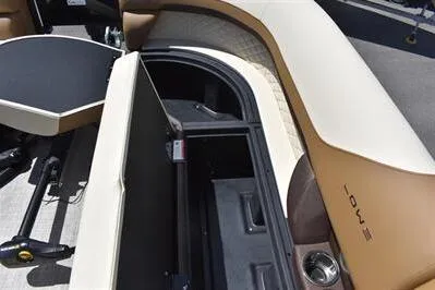 Slide: The Image of 2026 Lowe SF 232 Sport Fish boat interior with storage compartment open. - 18