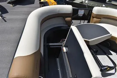 Slide: The Image of 2026 Lowe SF 232 Sport Fish boat interior with cushioned seating and storage compartments. - 21