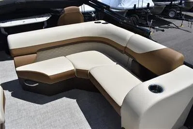Slide: The Image of 2026 Lowe SF 232 Sport Fish boat interior with beige and brown seating arrangement. - 22