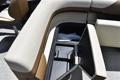 Slide: The Image of 2026 Lowe SF 232 Sport Fish boat interior with open storage compartment. - 23