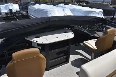 Slide: The Image of 2026 Lowe SF 232 Sport Fish boat interior with seating and covered console. - 24