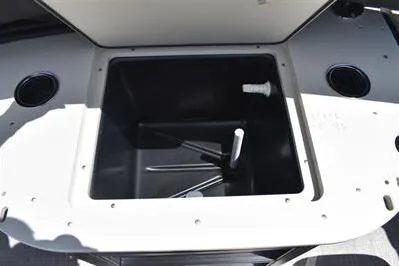 Slide: The Image of 2026 Lowe SF 232 Sport Fish boat livewell with open lid and cup holders. - 28