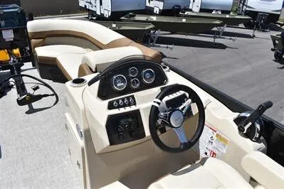 Slide: The Image of 2026 Lowe SF 232 Sport Fish boat interior with steering console and seating. - 30