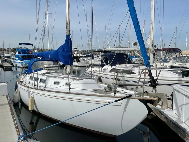The Image of 1980 Rival 32 sailboat docked in marina. - 0