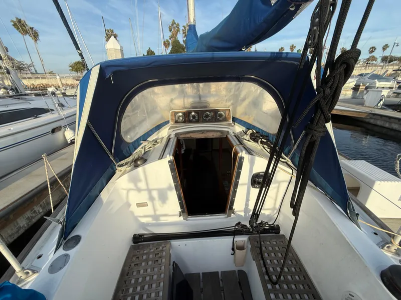 Slide: The Image of Cockpit of a 1980 Rival 32 sailboat docked in marina. - 12