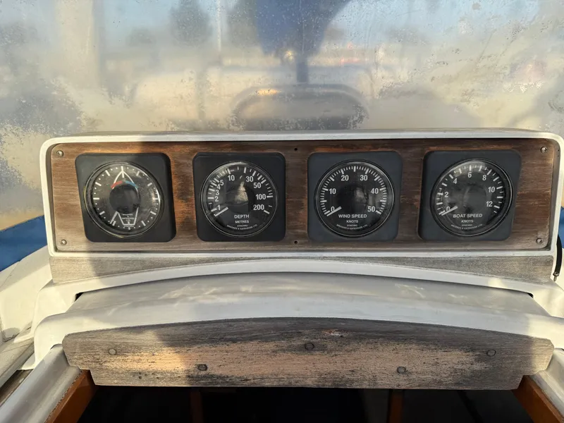 Slide: The Image of Dashboard of a 1980 Rival 32 boat with instruments. - 14