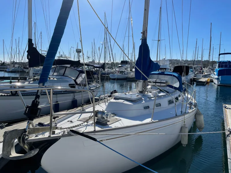 Slide: The Image of 1980 Rival 32 sailboat docked in marina. - 2