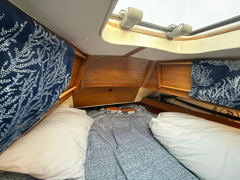 Slide: The Image of Interior of a 1980 Rival 32 yacht with cozy bedding. - 22