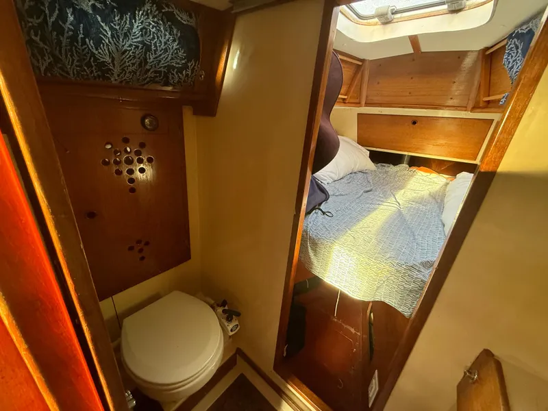 Slide: The Image of Interior of a 1980 Rival 32 yacht with bed and toilet. - 24