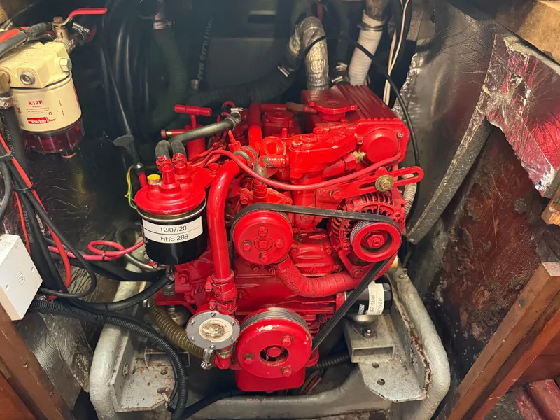 Slide: The Image of 1980 Rival 32 engine, painted bright red. - 25